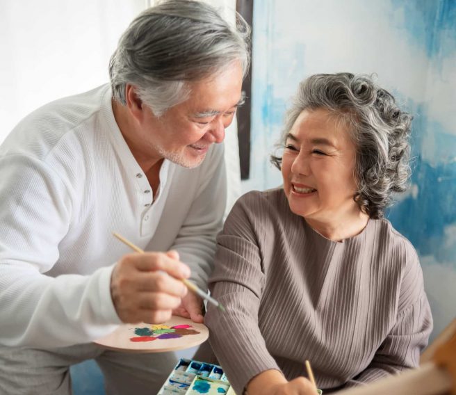 Man and woman painting together