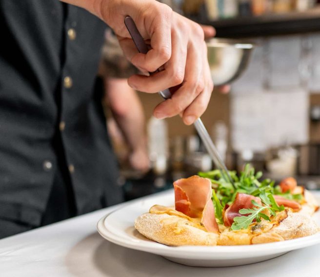 Chef preparing dish in a kitchen